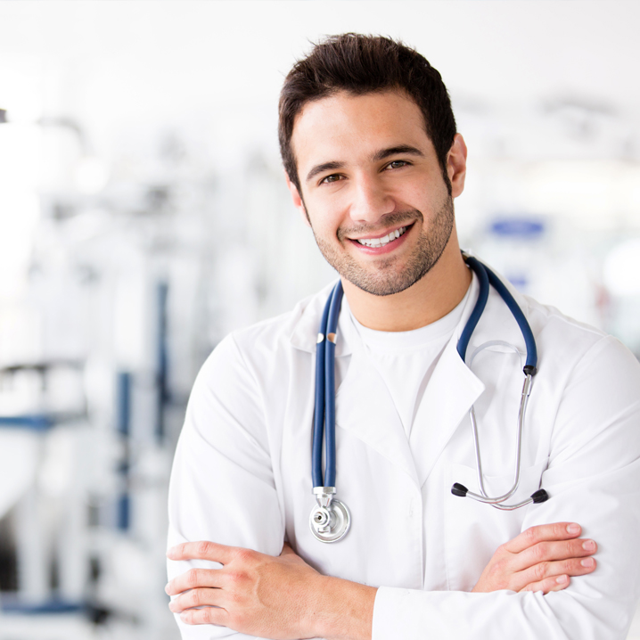 A male doctor with his arms crossed
