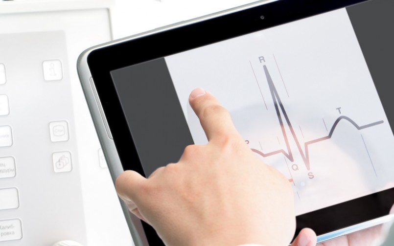 A person is touching the screen of a tablet.