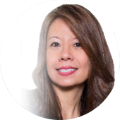 A woman with long hair is smiling for the camera.
