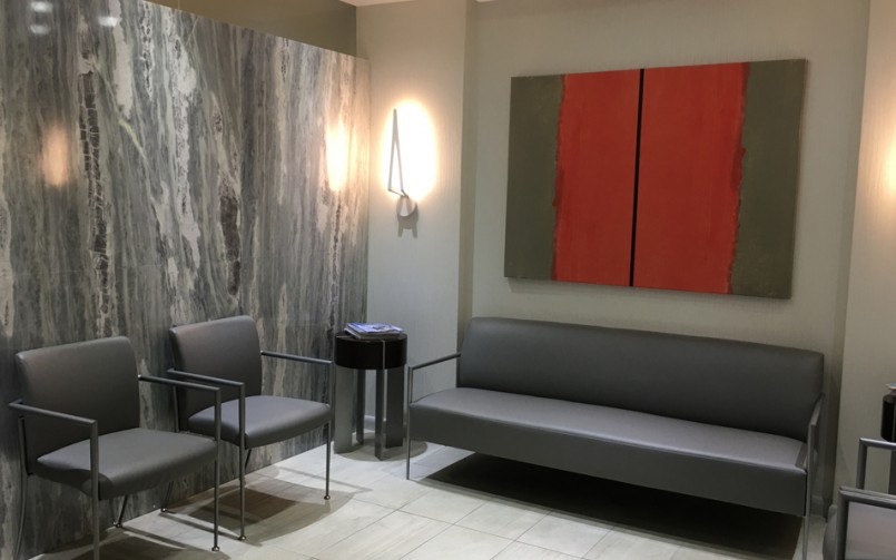 A room with two chairs and a couch