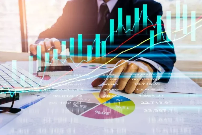 Businessperson analyzing financial data charts.
