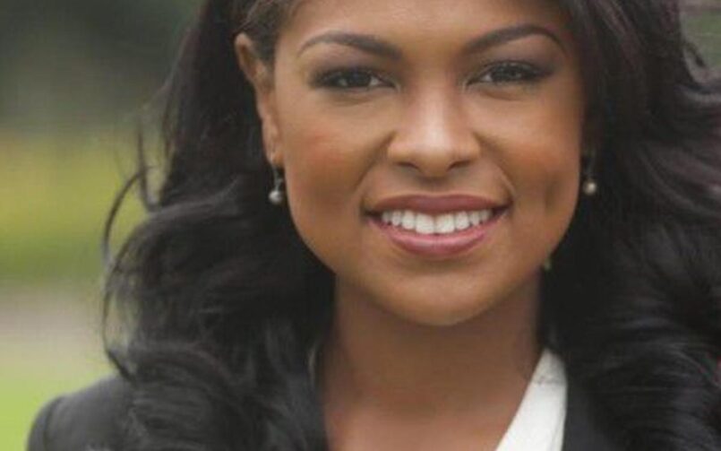 Portrait of a smiling Black woman.