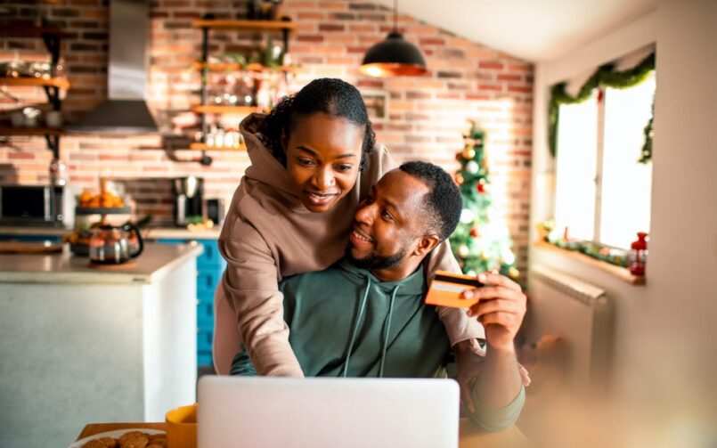 Couple Christmas online shopping credit card.