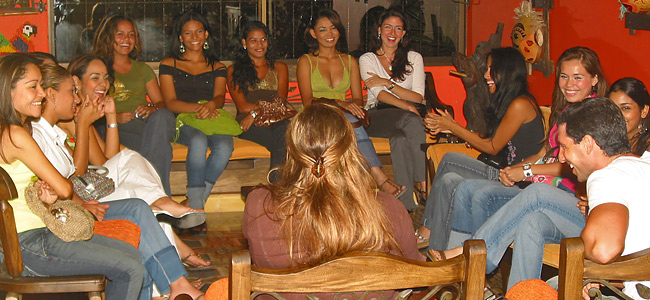 Group of women laughing and socializing.